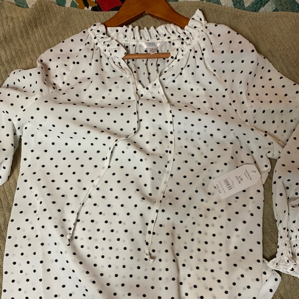 White and black polka dot blouse